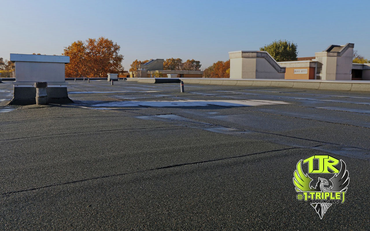 Energy-efficient flat roofs with reflective coatings designed to reduce heat and lower cooling costs.